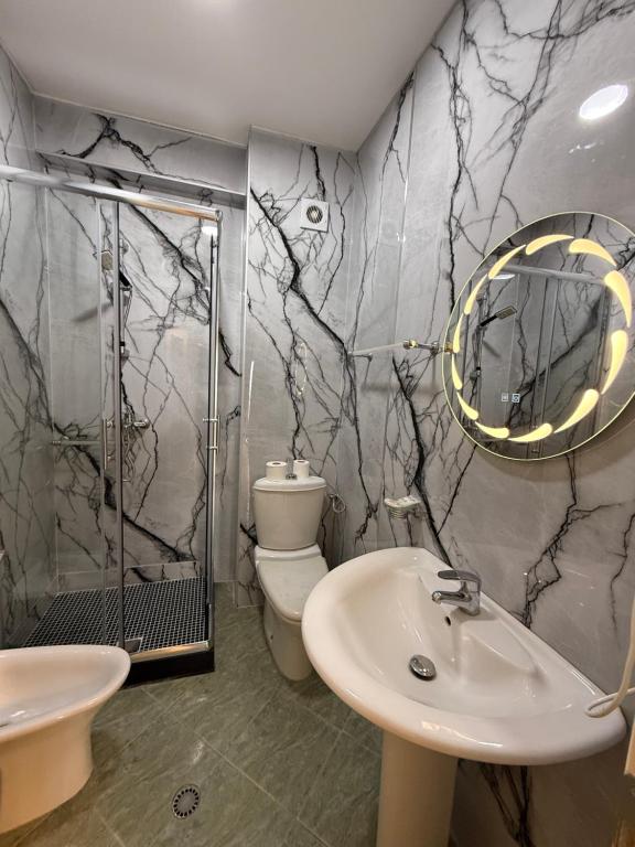 White marble bathroom with walk-in shower