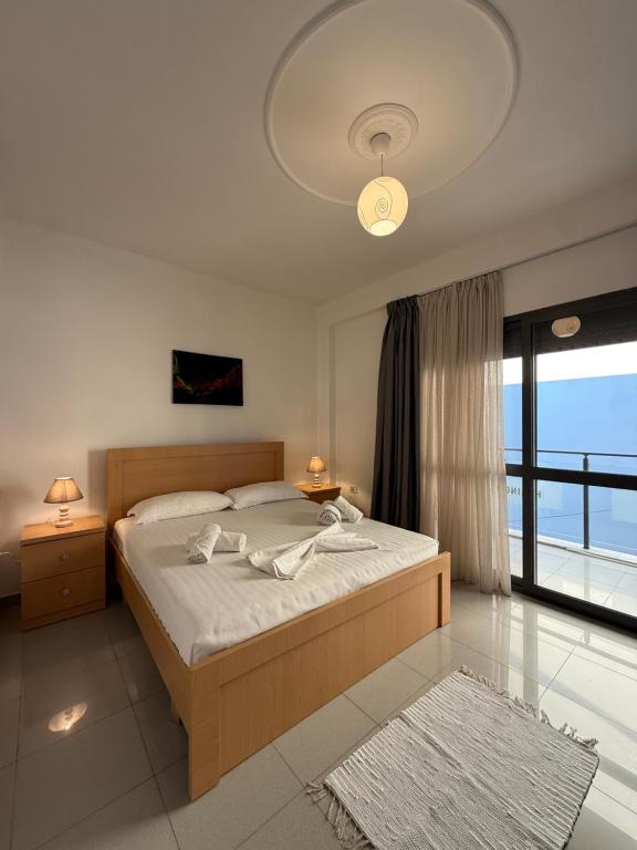 Wide bedroom with full-height balcony doors