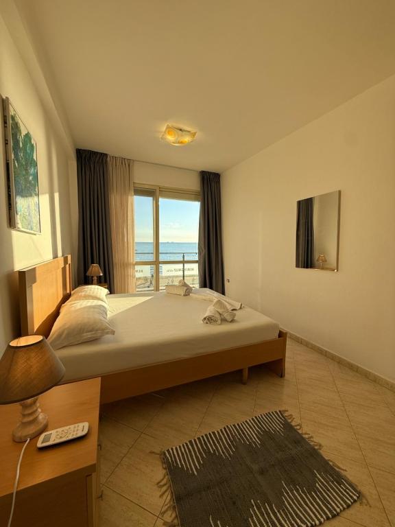 Bedroom with bedside lamp and Adriatic view