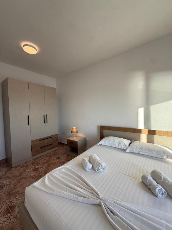 Bedroom with built-in wardrobe and crisp made bed