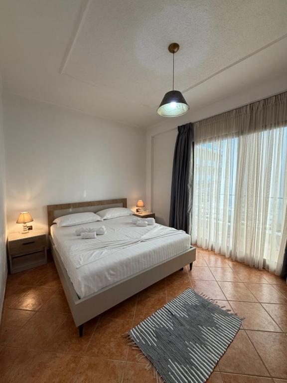 Bedroom in warm afternoon light with curtains drawn