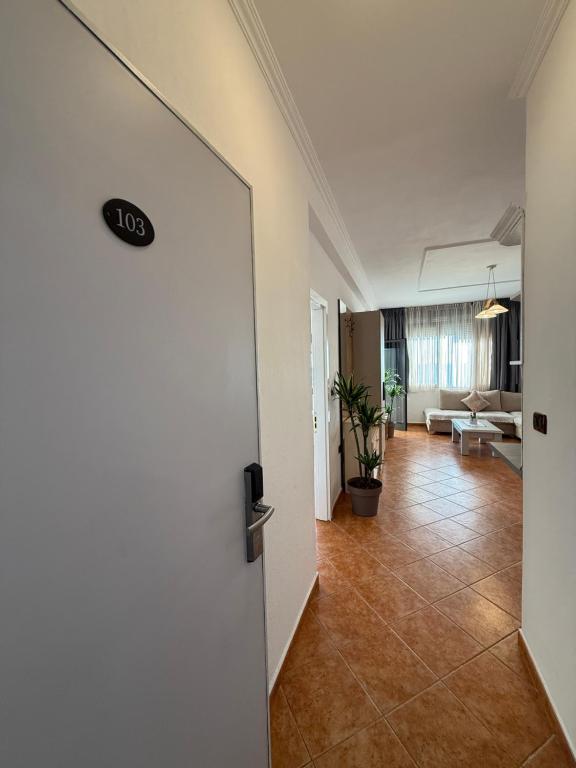 Hallway entry to suite 103 leading into the lounge