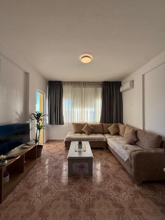 Spacious suite with large sectional and warm light