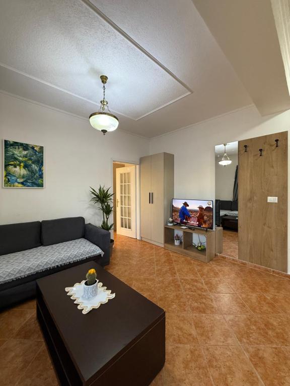 Suite with dining table, kitchen and feature painting