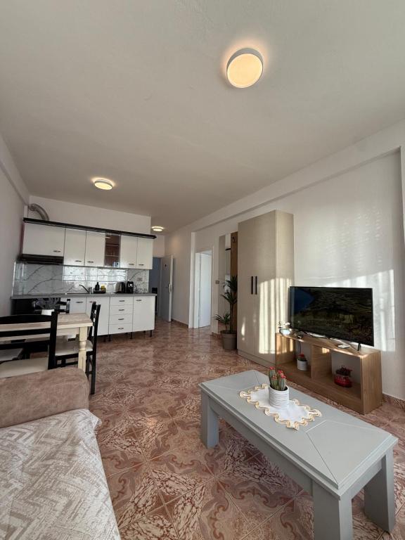 Open-plan suite with kitchen and living room flowing together